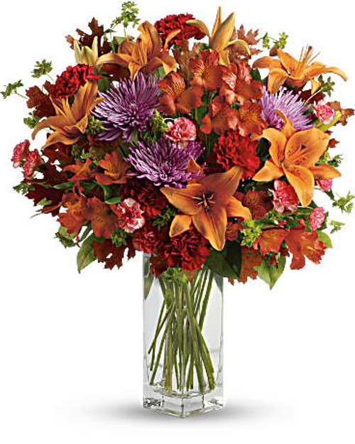 Ring in the season with this fresh, colorful arrangement of lilies and alstroemeria. Hand-delivered in our beautifully crafted vase, it's an easy way to brighten anyone's day!