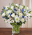 Sincerest Sorrow™ Blue & White
A sincerity of sentiment means so much to those grieving. Our bountiful, heavenly blue and white bouquet features a soothing mix of blue delphinium, alstroemeria, and white roses, hand-designed inside a classic clear glass vase. When sent to a service or to the home of family or friends, it makes a genuinely heartwarming gesture.