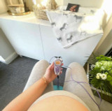 Elle tens in hand of pregnant women