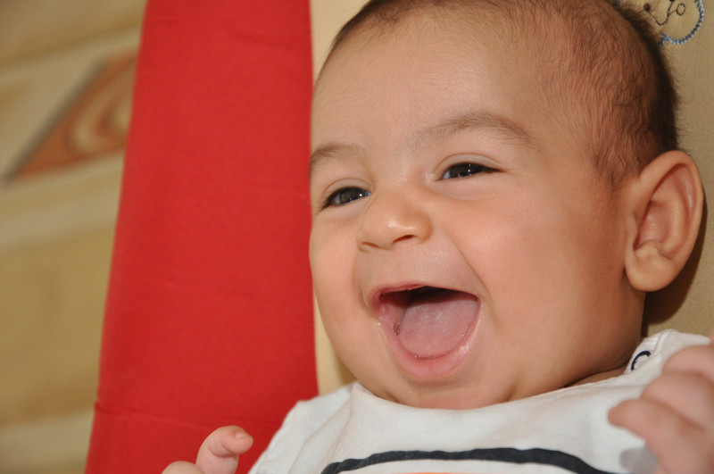 When do babies have their first laugh?
