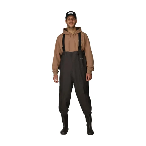 FROGG TOGGS Frogg Toggs Rana II Chest Waders, a person wearing waterproof chest waders with adjustable suspenders, rubber boots, and outdoor clothing for fishing or hunting.
