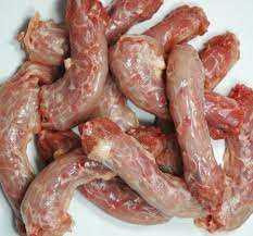 F&F Chicken Necks, fresh raw chicken necks piled together on a white surface.