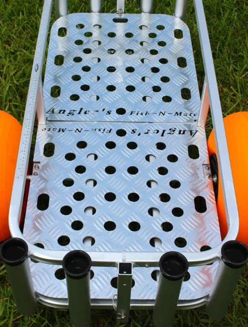 ANGLER'S FISH-N-MATE Fish-N-Mate 884 Diamond Bottom Plate, close-up of the perforated silver diamond-plate bottom installed on a fishing cart with rod holders, shown on grass.