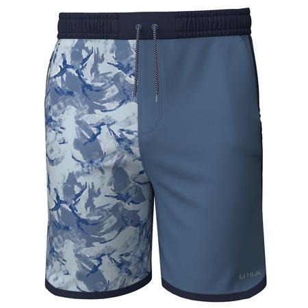 HUK LONG CAYE BOARDSHORT PRINT BLOCK, image of men's long swim shorts with a blue and white abstract pattern on one side and solid blue on the other, featuring an elastic waistband and drawstring.