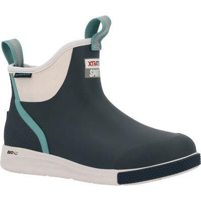 XTRATUF XADSW109 Women's Ankle Deck Boot, image of a dark navy waterproof ankle boot with a light blue and teal pull tab and sole accents, designed for durability and protection in outdoor weather conditions.