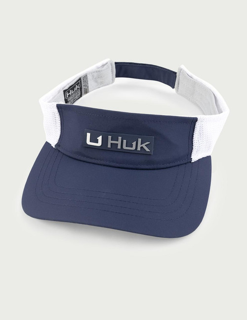 HUK Side Arm Visor, navy blue and white visor with adjustable strap and HUK logo on the front.
