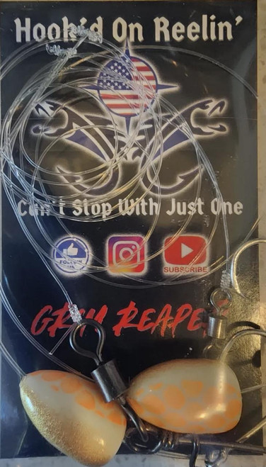 Hook'd On Reelin' Grim Reaper Rigs, fishing rigs with orange and yellow lures and hooks displayed on a black background with brand and social media icons.