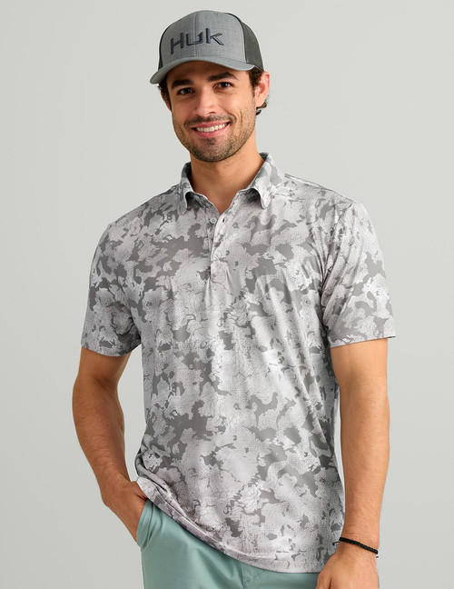 HUK Pursuit KC Printed Polo, stylish men's golf polo featuring a grey and white camouflage pattern, short sleeves, and a classic collar.