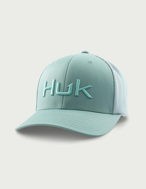HUK Embroidered 110 Trucker, stylish light blue cap with mesh back and raised embroidered HUK logo on front.