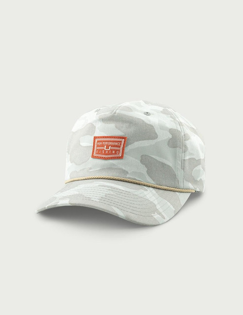 HUK Printed Unstructured Hat, light gray camouflage design with a rectangular orange patch and beige rope detail on the brim.