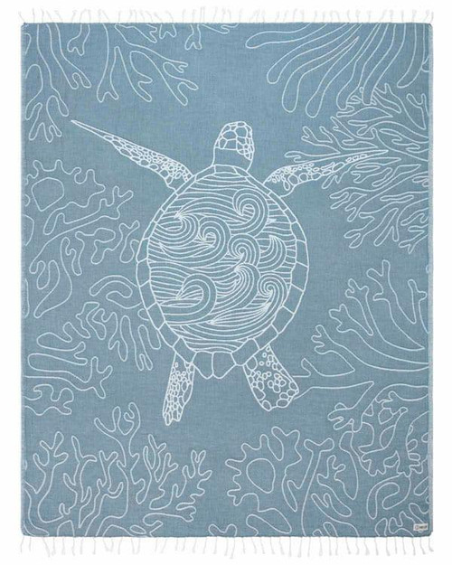 SAND CLOUD Sand Cloud Beach Towels, a light blue towel featuring a white line art turtle swimming among coral reefs.