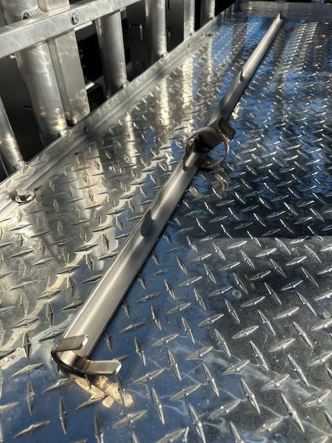 DEERFIELD FABRICATION Deerfield Tournament Spike, a stainless steel spike with a handle for easy insertion, placed on a metal diamond plate surface.