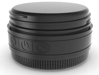 TOADFISH Toadfish Wireless Speaker Attachment, compact black cylindrical wireless speaker attachment with a perforated grille and embossed control buttons, shown on a white background.