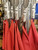 OTW Sand Sticks, Metallic silver sand shovels with red fabric tool pouches attached with carabiner clips.