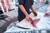SORD Fishing Products Knives, a fisherman filleting a large fish on a boat dock using a SORD fishing knife.