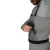 FROGG TOGGS Frogg Toggs Hellbender Pro Boot Foot Chest Wader, close-up of a man wearing gray chest waders and adjusting the front pocket flap and black waist belt.