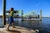 BETTS TACKLE Betts Buddy Throw Net, a young boy throwing a fishing net into the water from a dock.