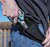 TOADFISH Toadfish Utility Shears, person holding the shears inside a black sheath attached to a belt.