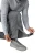 FROGG TOGGS Frogg Toggs FTX Lite Pant, lightweight waterproof rain pants being worn with a person adjusting the ankle strap, ideal for outdoor rain protection.
