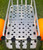 ANGLER'S FISH-N-MATE Fish-N-Mate 877 Smooth (Flat) Bottom Plate, metal fish handling platform with multiple circular holes for drainage, mounted on a cart with orange wheels, suitable for fishing activities.