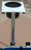 ANGLER'S FISH-N-MATE Fish-N-Mate CB-1 Bait Basket, a close-up of a bait basket mounted on a pole for easy bait management during fishing.