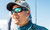 Costa Costa Blackfin Pro sunglasses, outdoor man wearing sporty sunglasses with reflective lenses and a gray cap, sunny weather.