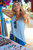 HUK WAYPOINT FLOW TANK, woman smiling and looking happy at an outdoor market.