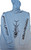TORMENTER Tormenter F&F SPF Fish Wrap Hoodie, blue hoodie with fish skeleton graphic and brand logos on the sleeves.