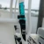 Toadfish Fixed Fillet Knife with Sheath, blue and black fishing knife secured on a white metal frame.