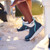 XTRATUF XADSW-109 Women's Deck Boot, stylish navy and white waterproof outdoor footwear on sandy surface