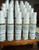 ADIOS MO SKITOS!, natural mosquito repellent spray bottles on a wooden display