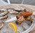 TOADFISH Toadfish Wood Handle Oyster Knife, oyster knife on a bed of ice with freshly shucked oysters and a lemon wedge