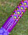 Nick's Custom Rods 2025 Nick's Custom Rods - CTS 1305, a colorful fishing rod with a geometric pattern in purple, black, yellow, and red, featuring a purple band with a signature logo.