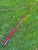 NICK'S CUSTOM RODS 2025 Nick's Custom Rods - CTS 1305, red fishing rods lying on green grass.