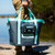 TOADFISH Toadfish Waterproof Tote & Sling, a large waterproof tote bag with light blue and dark gray color, featuring handles and a front zippered pocket, suitable for outdoor activities near water.