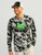 HUK Icon KC Printed LS Crew, a man wearing a long-sleeve printed crew neck shirt with black, white, and green camouflage patterns and a neon green HUK logo, paired with a black and white trucker cap.