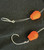 Hook'd On Reelin' Grim Reaper Rigs, fishing hooks with orange buoyants for deep-sea fishing.