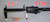 Psycho's Surf Fishing Ghost Shrimp Float Rigs Rattler & VooDoo, fishing bait rigs with transparent ghost shrimp floats and bright orange accents, displayed on a measuring tape showing 3.5 inches or 9 centimeters for size.