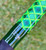 NICK'S CUSTOM RODS 2025 Fall Nick's Custom Rods - CTS 1205 Spinning, close-up of a vibrant, multicolored fishing rod with geometric green and blue patterns and branding details.