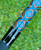 NICK'S CUSTOM RODS 2025 Fall Nick's Custom Rods - CTS 1205 Spinning, close-up of a colorful fishing rod with a geometric blue, black, and gold design on the handle, with a blurred green grassy background.