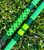 NICK'S CUSTOM RODS 2025 Fall Nick's Custom Rods - CTS 1205 Spinning, vibrant green fishing rods with geometric patterns, on green grass.