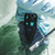 TOADFISH Toadfish Inshore 8" Stainless Pliers - Elite Series, a person wearing fishing gear holding the stainless pliers near water.