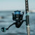 TOADFISH Toadfish Surf Combo, close-up of a fishing rod with a spinning reel and line, suitable for surf fishing.