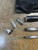 NINJA TACKLE Ninja Tackle Dagger Midnight Bomber LE 13'3" Surf Rod, disassembled components and carrying case, on concrete surface.
