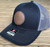Nick's Custom Rods Nick's Custom Hat, a navy blue trucker cap with a brown leather patch featuring the brand name, and a mesh back for breathability.