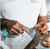 TOADFISH Toadfish Crab Mallet, a person cracking crab shell with a specialized crab mallet.