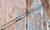 NINJA TACKLE Ninja Tackle Lil Bummy 9'6" Spinning Rod, a yellow and black fishing rod laid on a rusted metal surface.