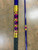 Full Send Rod Co. Custom CTS 1304 fishing rod, close-up view of the vibrant gold, purple, and black design on the rod's handle and shaft.