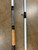 Full Send Rod Co. Custom CTS 1305 fishing rod, with a black and white patterned handle and white shaft, placed on a concrete surface.