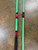 Full Send Rod Co. Custom CTS 1305 fishing rod, green with black and red accents, displaying a handle and vibrant design.